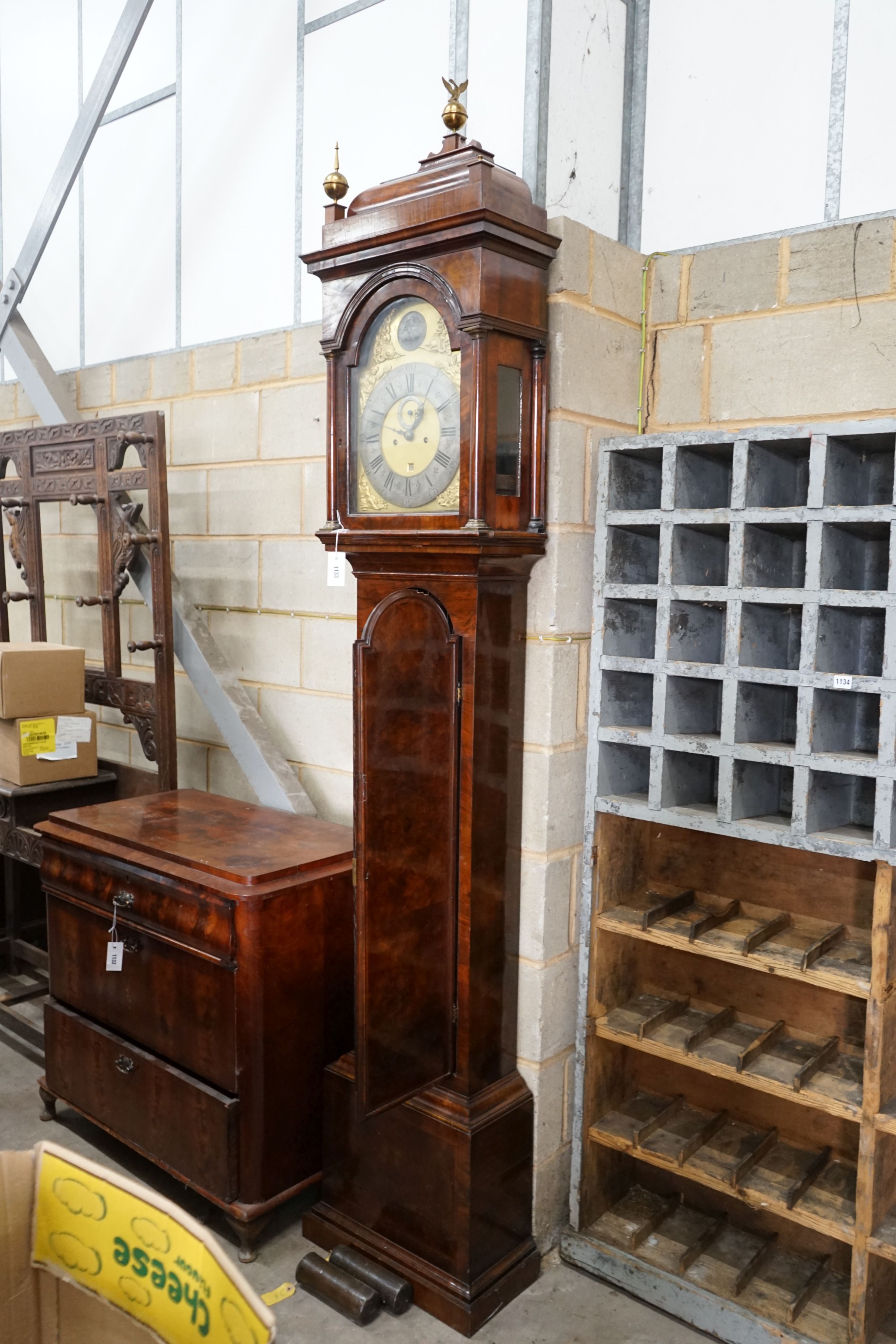 A George III feather banded walnut 8 day longcase clock, height approx. 250cm